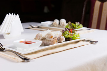 Plates of Spring Rolls Appetizers on Table