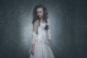 Classic fashion style brunette woman. Wearing white corset and d