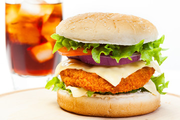 Chicken burger and glass of cola