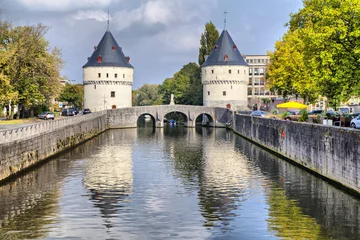 Gartenposter Medieval Broel Towers and old bridge in Kortrijk city © bbsferrari