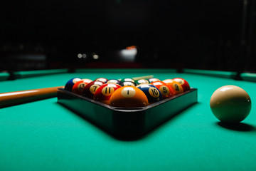 Billiard balls in a pool table. - obrazy, fototapety, plakaty