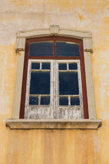 Aged window with peeling paint.