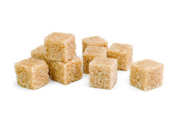 Brown sugar, a few pieces. Isolated on white