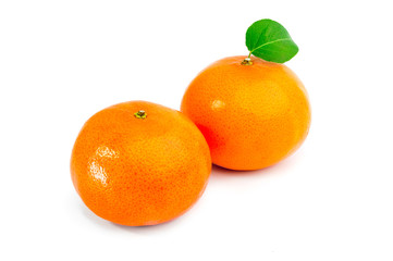 Ripe two tangerines (mandarin) with green leaf isolated on white