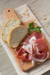 Bread and Ham Slices on a Cutting Board