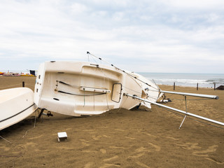 The boat overturned on the beach.