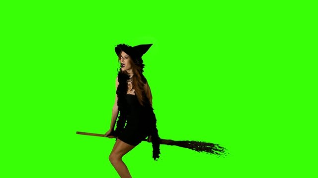 Halloween witch flying on a broomstick green screen