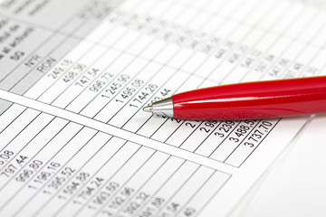 Pen over business chart