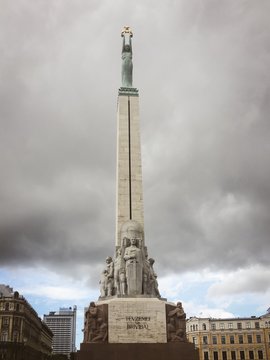 freedom monument in riga latvia with atorm clouds behind