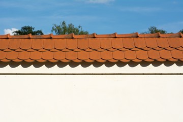 Wall with red roof