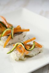Hake in pieces grilled with vegetables