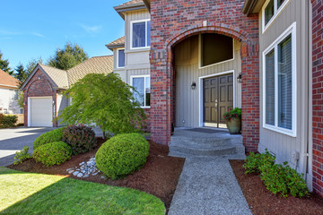 Luxury house entrance porch with brick trim