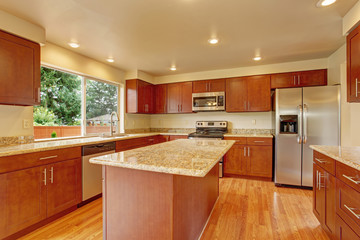 Kitchen furniture with island in empty house