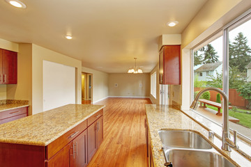 Kitchen furniture with island in empty house