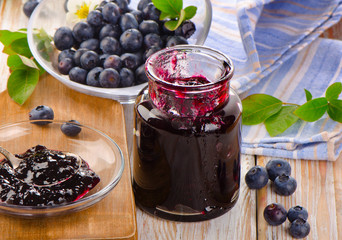 Fresh blueberries jam  on  wooden table.