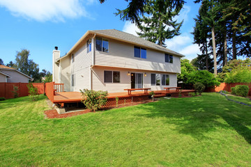 House with spacious wooden walkout deck