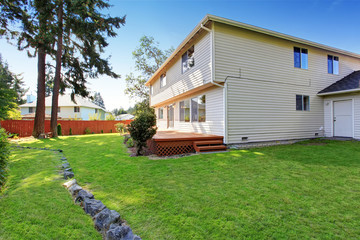 House with spacious wooden walkout deck