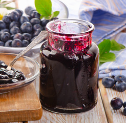 blueberries jam  on  wooden table.