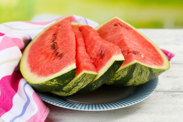 Fresh slice of watermelon on table outdoors, close up © Africa Studio