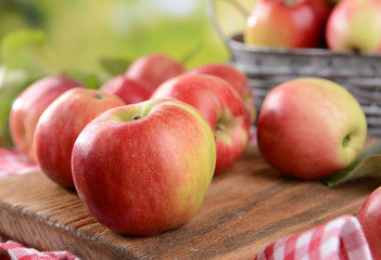 Sweet apples  on table on bright background