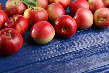 Sweet apples on wooden background