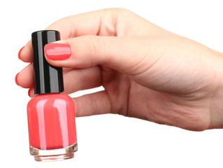 Nail polish in hand, close-up