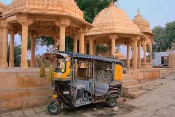 Decorated tuk-tuk parked at Gadi Sagar temple, Jaisalmer, India