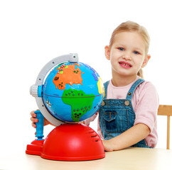 Little girl sitting at the table