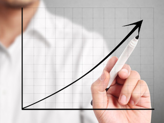 Man hand drawing a chart