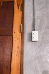 white plastic switch panel is on loft style wall