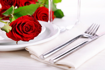 Obraz na płótnie Canvas Table setting with red rose on plate
