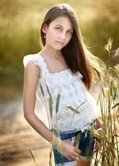 portrait of little girl outdoors in summer