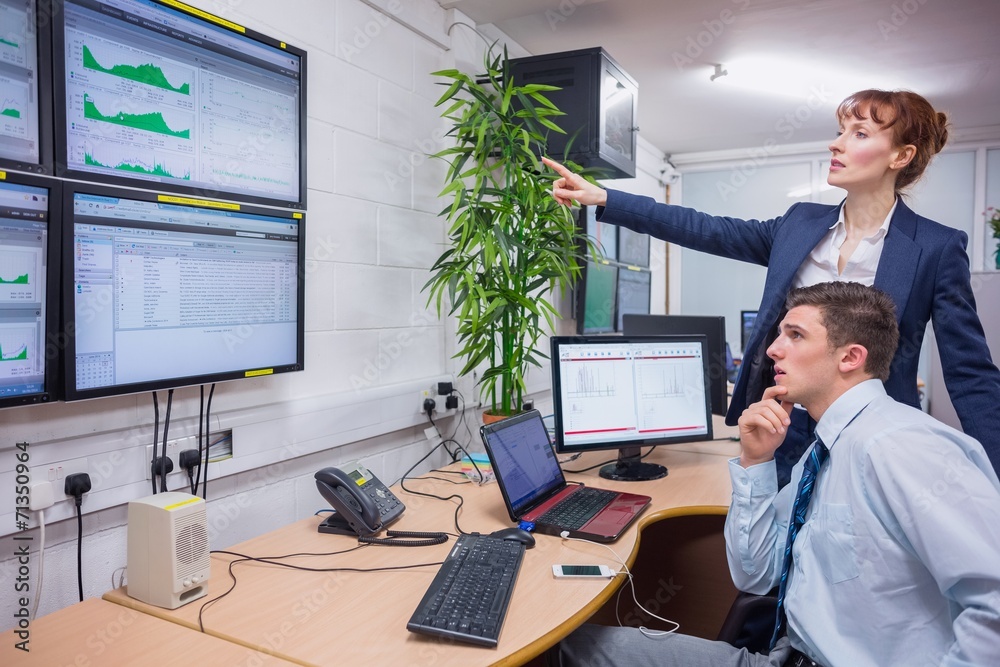 Aufkleber Focused colleagues analyzing result on their computer