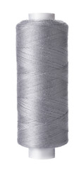 Single reel of gray thread on white background