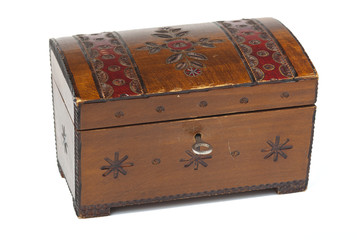 old scratched wooden casket with an ornament on a white backgrou