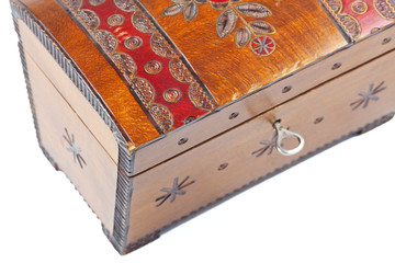 old scratched wooden casket with an ornament on a white backgrou