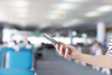 Businesswomen use smart phone during the tourist trip