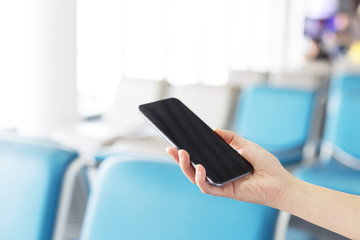 Businesswomen use smart phone during the tourist trip