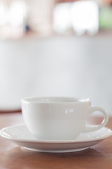 White mug on wooden table