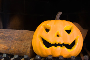Halloween pumpkin in a fireplace