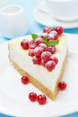 cheesecake with red currants on the plate