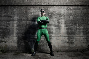 Confident superhero standing with arms crossed © stokkete