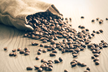 coffee beans spill out of the sack