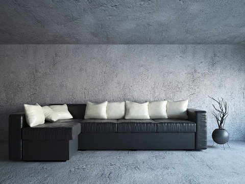 Sofa near the concrete wall