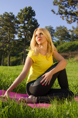 Cute blonde looking at the sun meditation