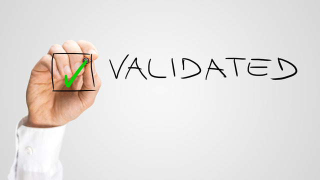 Hand Putting Check Inside Box for Validated Option