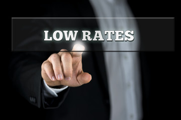 Businessman Pointing Low Rates on Transparent Box
