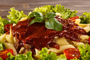Pasta with meat, tomato sauce and vegetables