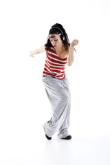 beautiful young woman listens to music and dances