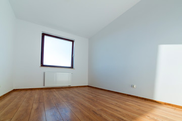 Fototapeta na wymiar Apartment interior with wooden floor after renovation